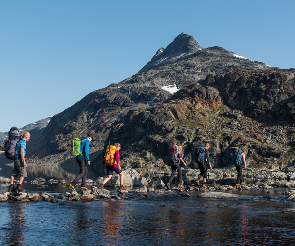 Crossing A River The Peak Uranostind In The Background